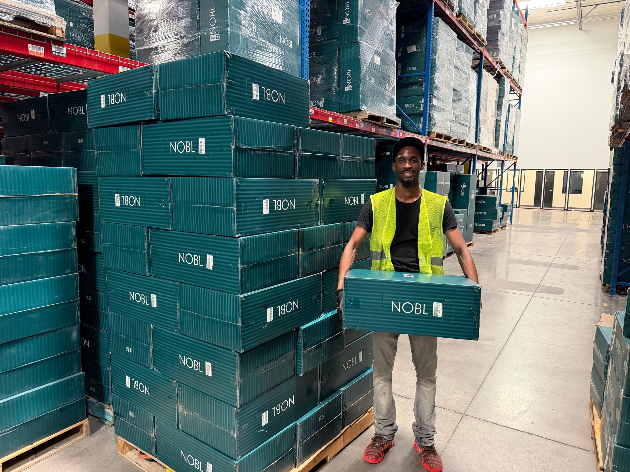 NOBL warehouse team member presenting the Carry-On: All-In-One