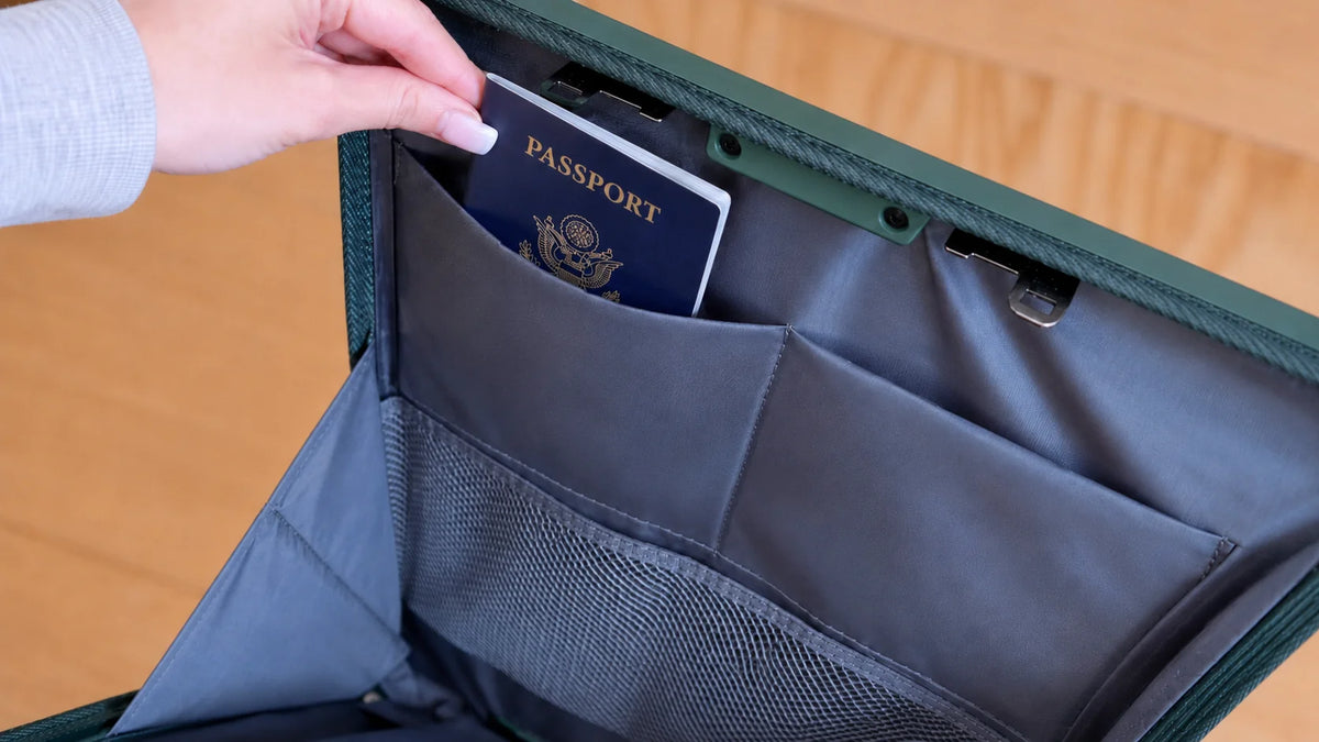 Cup and phone mounted on the NOBL Carry-On handle