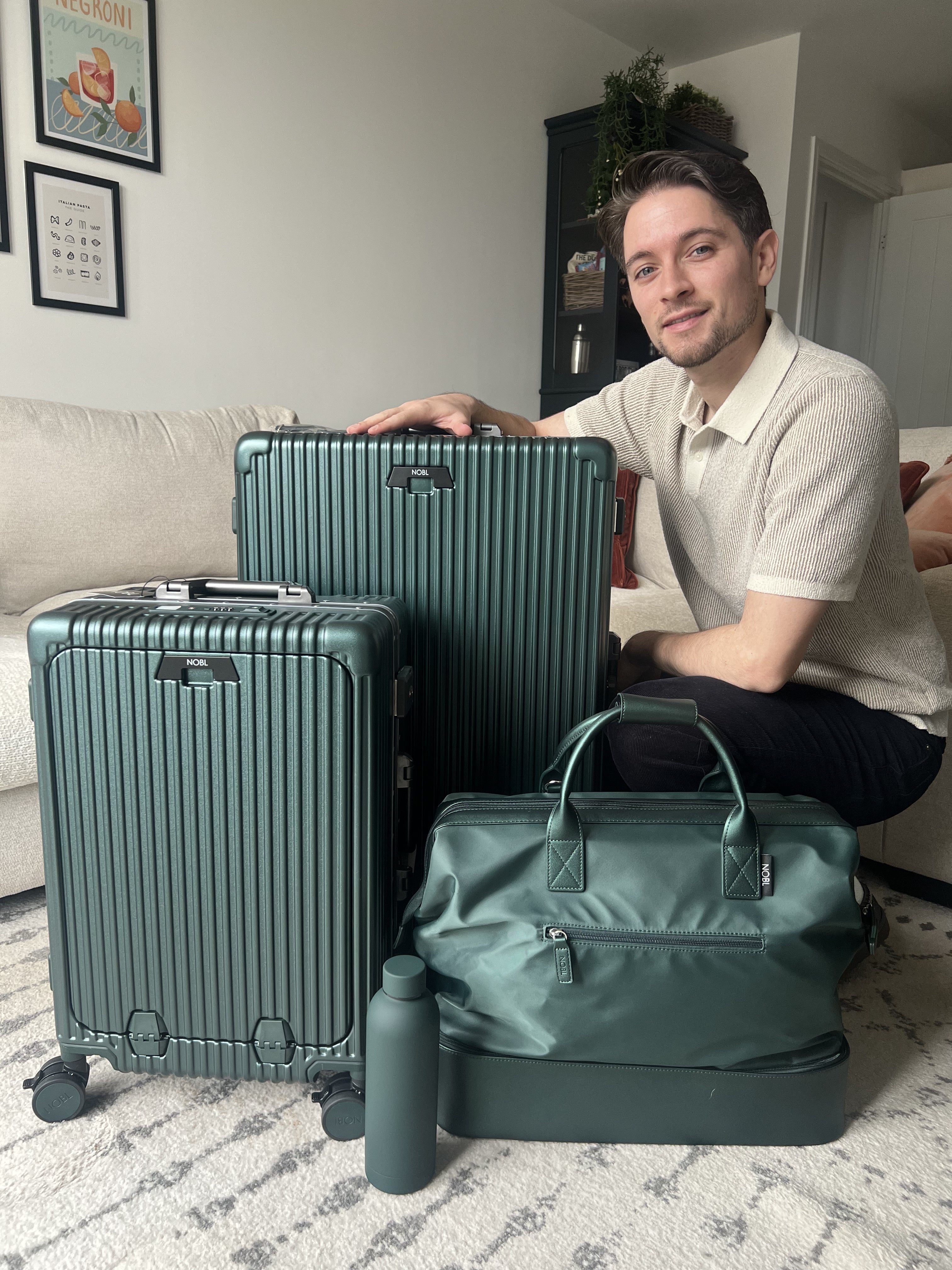 Traveler with a complete matching NOBL luggage set built for years of trips