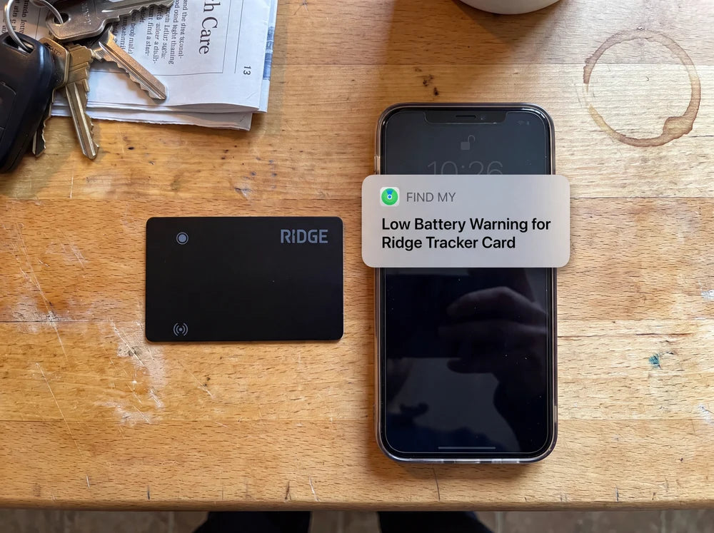 iPhone showing a Find My low battery warning for the Ridge Tracker Card